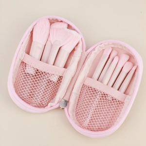 Set di pennelli da trucco rosa portatili con astuccio a cerniera e scomparto a rete