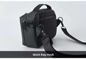 Detail of metal D-ring and detachable strap on black breathable nylon crossbody bag