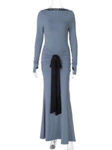 Detail of gray-blue maxi dress with ruched waist and black satin tie on white background