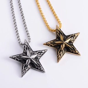 Vintage punk star pendant necklace in antique silver and gold finishes with engraved details