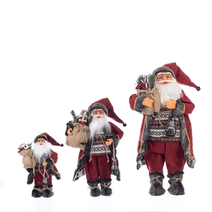 Set of three standing red fabric Santa Claus figurines in different sizes with gift bags