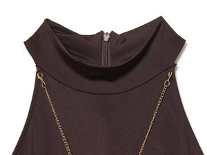 Detailed view of dark brown halter neck dress featuring delicate gold chain link accents
