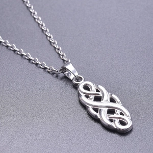 Macro detail of silver stainless steel Celtic knot pendant with durable metal chain links