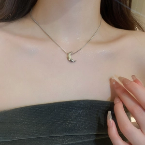 Minimalist silver moon pendant choker necklace for women worn on neck with sleek metal chain