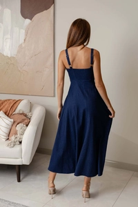 Detailed back view of a dark blue denim maxi dress with adjustable straps and open back