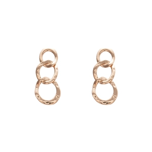 Textured gold triple-link hoop earrings with hammered metal finish on white backdrop