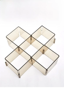 Detail of adjustable drawer dividers with modular interlocking design in amber finish
