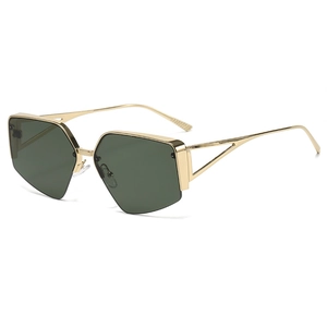 Close-up of geometric semi-rimless sunglasses with gold frames and dark green lenses