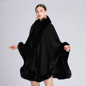 Elegant black knit poncho cape with faux rabbit fur collar and relaxed draped silhouette