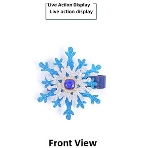 Detailed view of Christmas snowflake hair clip with blue sequins and square gemstone