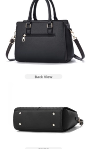 Detail view of the black textured leather tote bag back pocket and gold metal base feet
