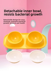 Detail view of detachable ivory inner bowls and splash-proof yellow base for pets