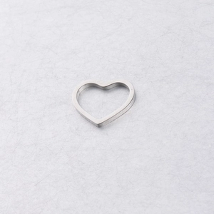 Detailed top view of a heart-shaped hollow pendant in polished silver stainless steel