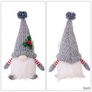 Front and back detail of a lit Christmas gnome ornament with a grey knitted hat