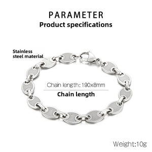 Detail view of silver stainless steel coffee bean chain with mesh texture and lobster clasp