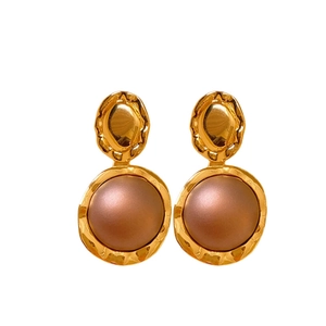 Vintage gold metal earrings with brown resin beads featuring a unique crinkle texture