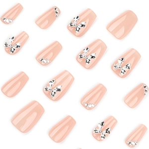 Pink nude trapezoid press-on nails with silver 3D metal bows and rhinestones