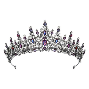 Close-up of royal crown headband with sparkling purple gems and crystals for girls