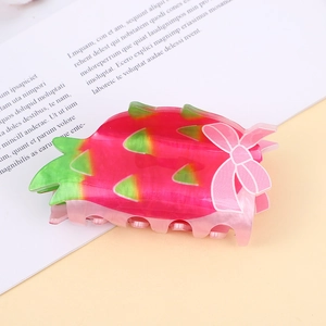 Modische Haarklammer in Drachenfrucht-Form aus Acetat in lebhaftem Pink und Grün