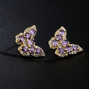 18K gold-plated butterfly stud earrings with purple stones and AAA zircons on black texture