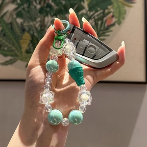 Mint green beaded keychain with acrylic ice cream pendant and metal spring hook charm