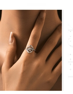 Close-up of sparkling s925 silver ring with criss-cross pavé bands on model's finger
