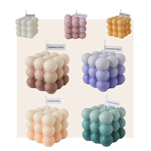 Set of colorful cube bubble candles with handmade labels for home decor and gifts