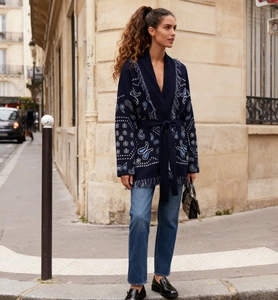 Chic long knit cardigan with blue paisley pattern and matching belt in street setting