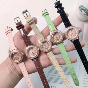 Five assorted colors of crystal-encrusted quartz watches with embossed leather straps