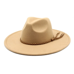 Close-up of wool felt jazz hat featuring braided leather belt and long side tassels