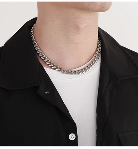 Silver stainless steel Cuban link necklace worn by model showing punk hip-hop style