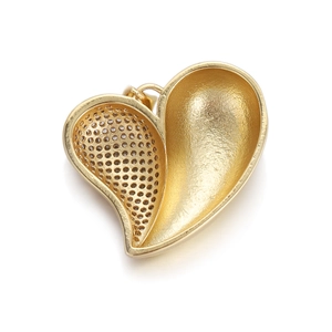 Detail view of 18K gold plated heart pendant with grid texture and polished finish