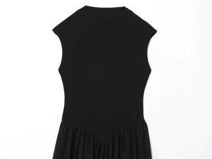 Detail of black sleeveless dress showing the mesh stitching and waist pleats design