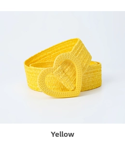 Detail of yellow woven elastic belt with heart-shaped buckle for stylish dresses