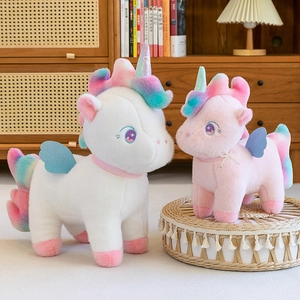 Rainbow unicorn plush toys in white and pink with colorful manes and wings