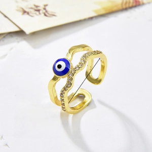 Detailed view of evil eye double ring with 18k gold plating and zircon inlay details