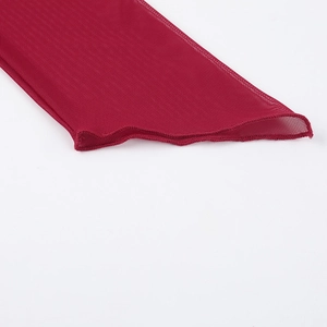 Close-up detail of red mesh fabric and stitching on an elegant slim-fit top