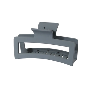 Detail view of large matte dark grey rectangular hollow hair claw clip with spring