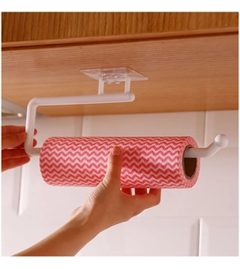 White plastic under-cabinet paper towel holder being used with a red striped paper roll