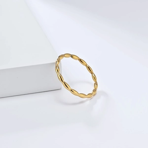 Detailed close-up of a French style teardrop 18K gold plated titanium steel ring