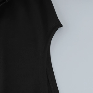 Close-up of sleeve stitching on a black off-shoulder dress with smooth elastic fabric