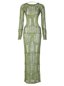 Sexy green knitted long sleeve maxi dress with cutout details on a white background