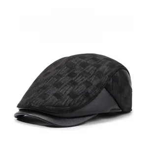 Detail view of winter baseball cap with leather earflaps and textured knit crown fabric