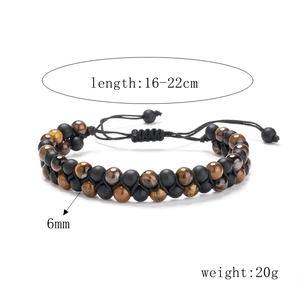 Detail view of 6mm tiger eye and matte black stone beads on braided adjustable cord