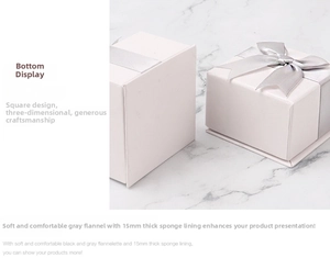 White jewelry gift box featuring 15mm sponge lining with grey velvet and silk bow detail