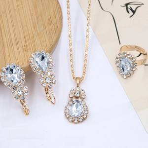 Detailed close-up of bridal jewelry set with pear-cut crystals and sparkling diamond accents