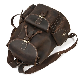 Detail view of crazy horse leather backpack with drawstring closure and magnetic flap cover