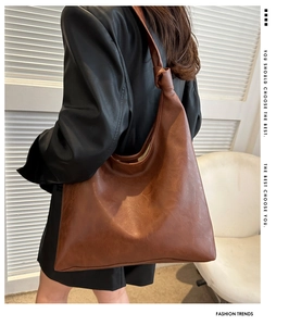 Brown leather large-capacity Hobo bag shown from a side and back view on model