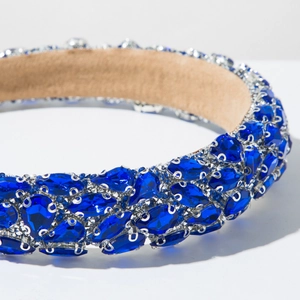 Detail of luxury baroque headband with blue teardrop rhinestones and beige suede lining