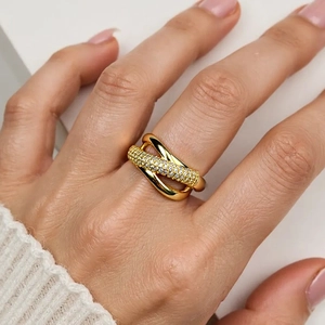 Macro view of 18K gold plated X-shaped crisscross ring with micro-pave cubic zirconia